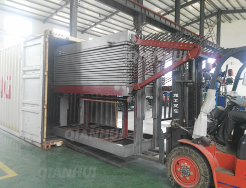 loading veneer dryer machine into container